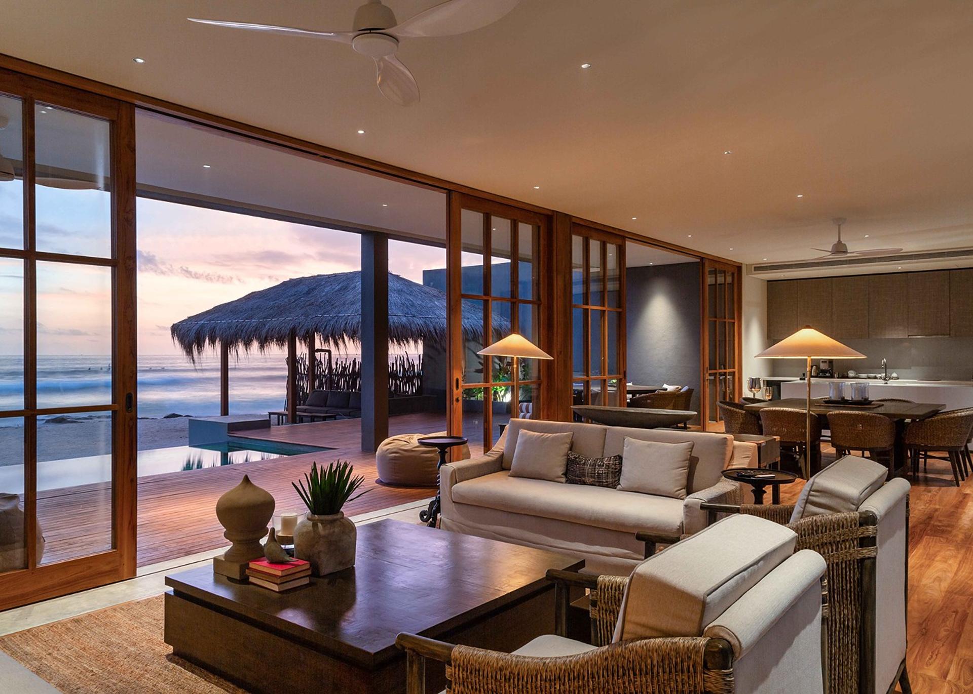 The Six Weligama living room in golden hour warm light, Midigama, Sri Lanka
