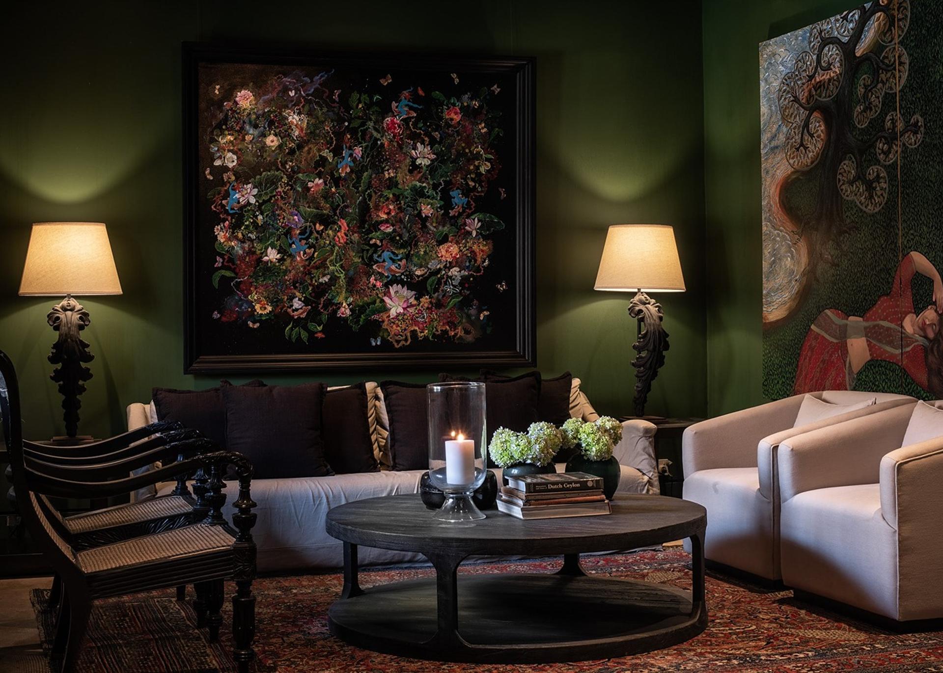 Formal living room with green wall, floral painting and cream chairs, No. 77 Leyn Baan Galle