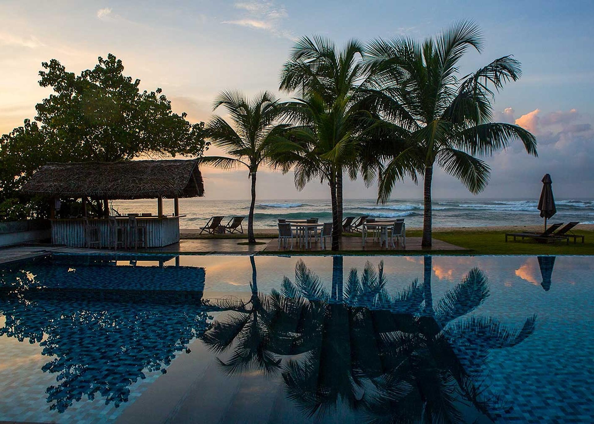Sunrise aerial pool and beach, Sri Sharavi Mirissa