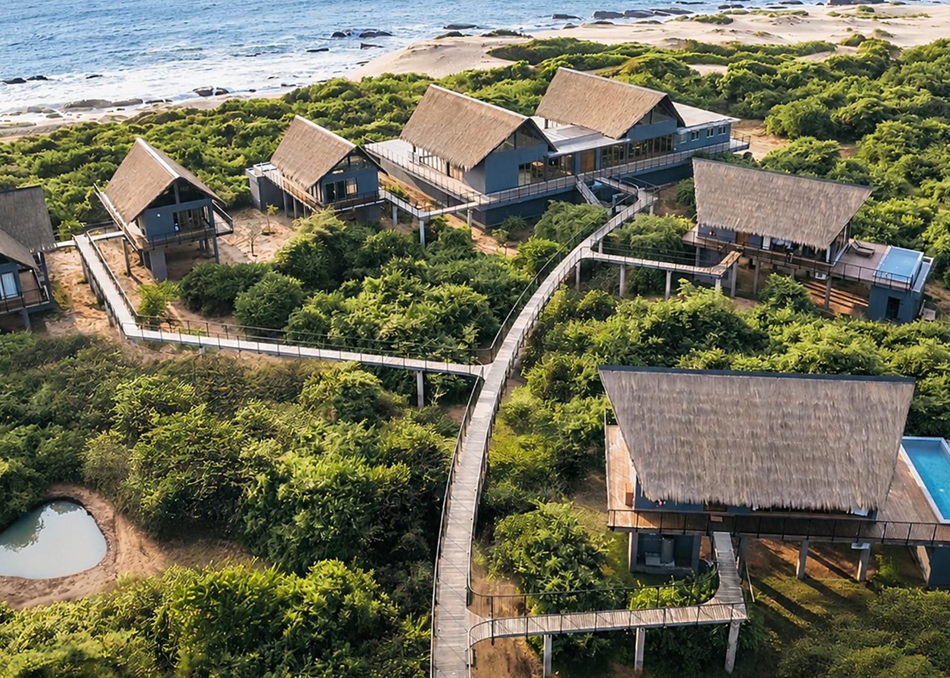 Aerial villa ocean and forest wide, Kotiyagala Yala