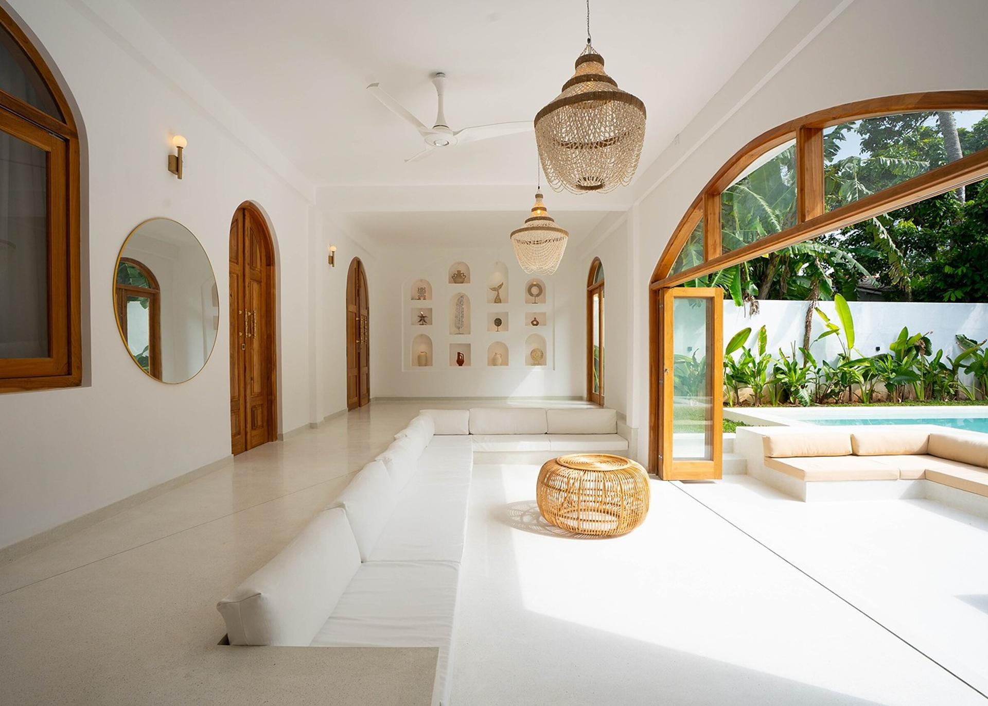 Arco House Ahangama living room with arches and pool view