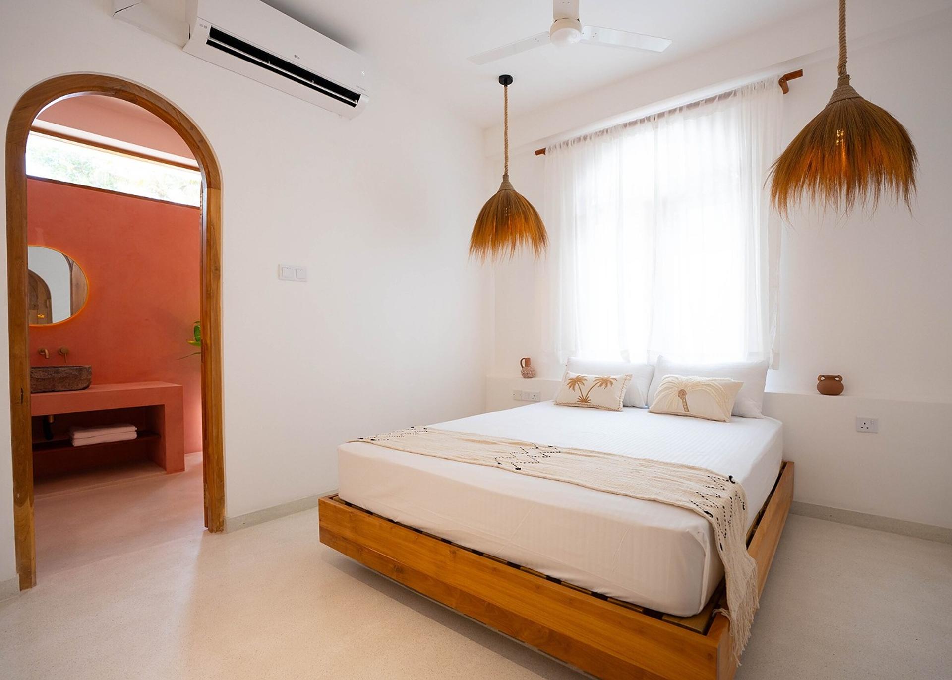 Ahangama bedroom with terracotta wall interior
