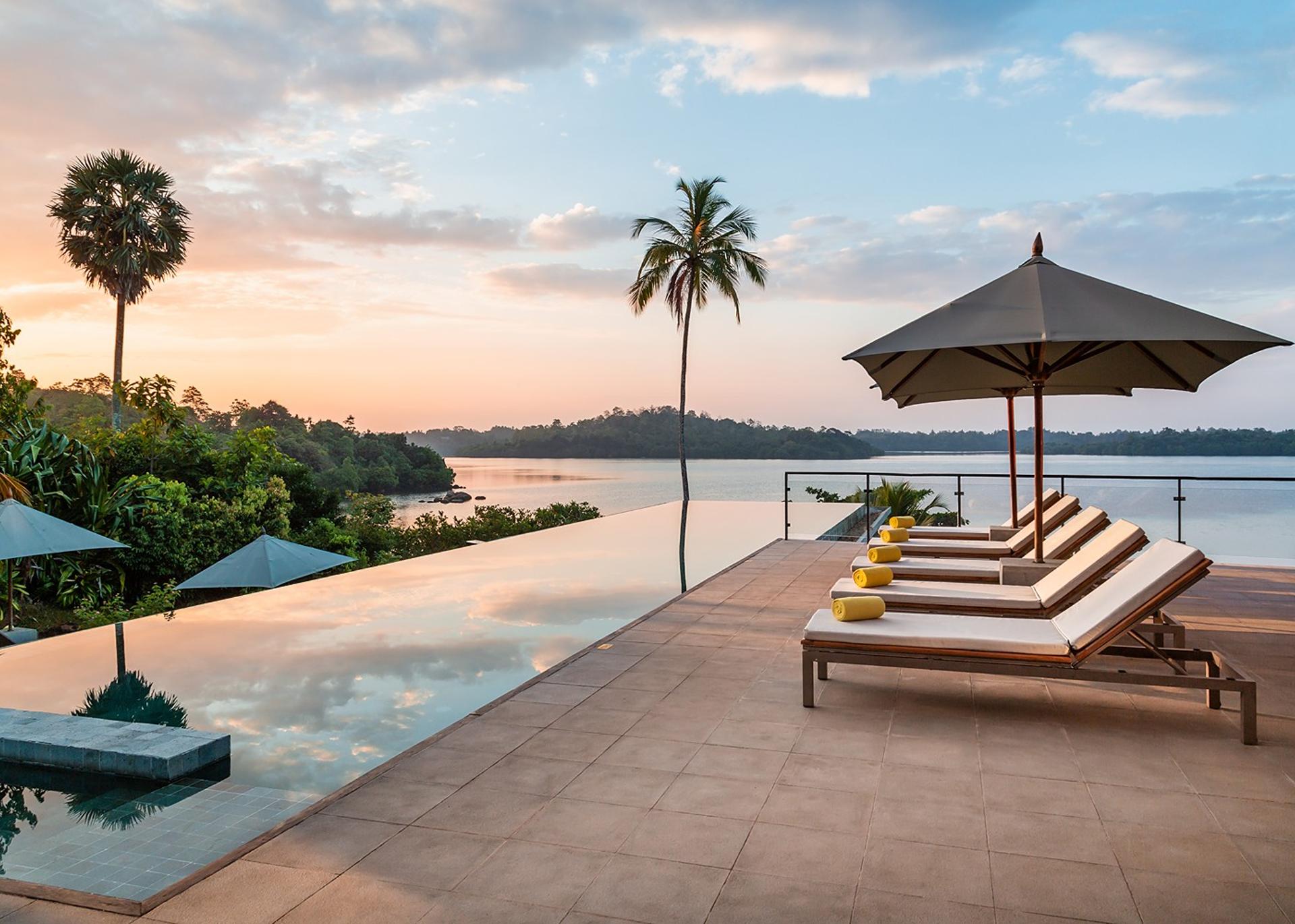 Tri Ahangama main pool with loungers at sunset