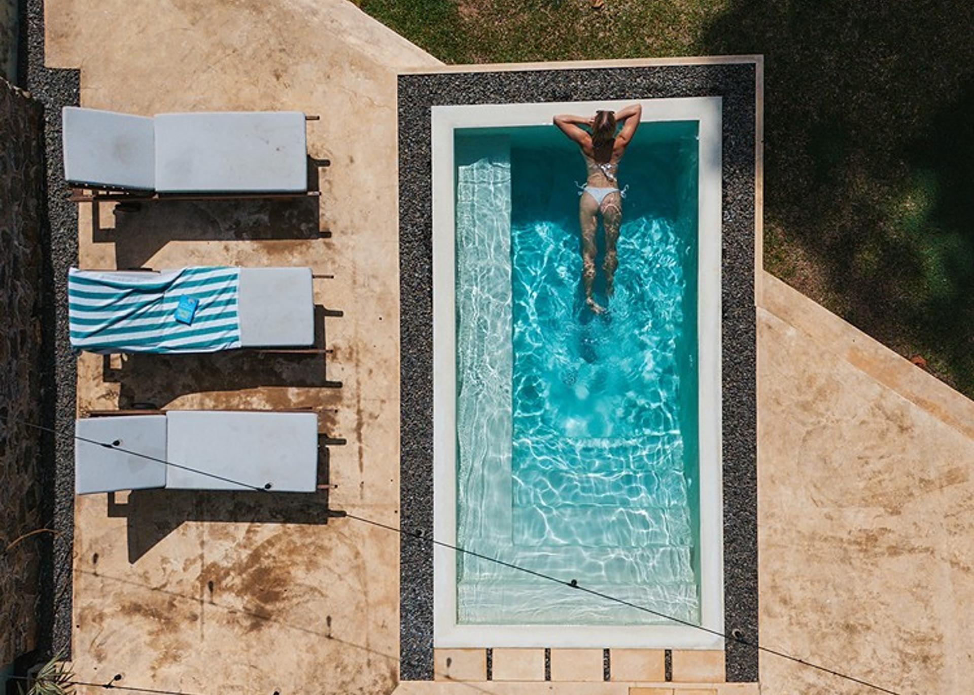 Kanda House Talpe aerial pool and lawn view