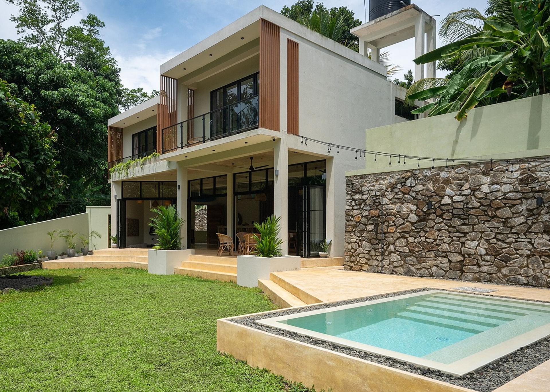 Kanda House Talpe exterior pool with garden view