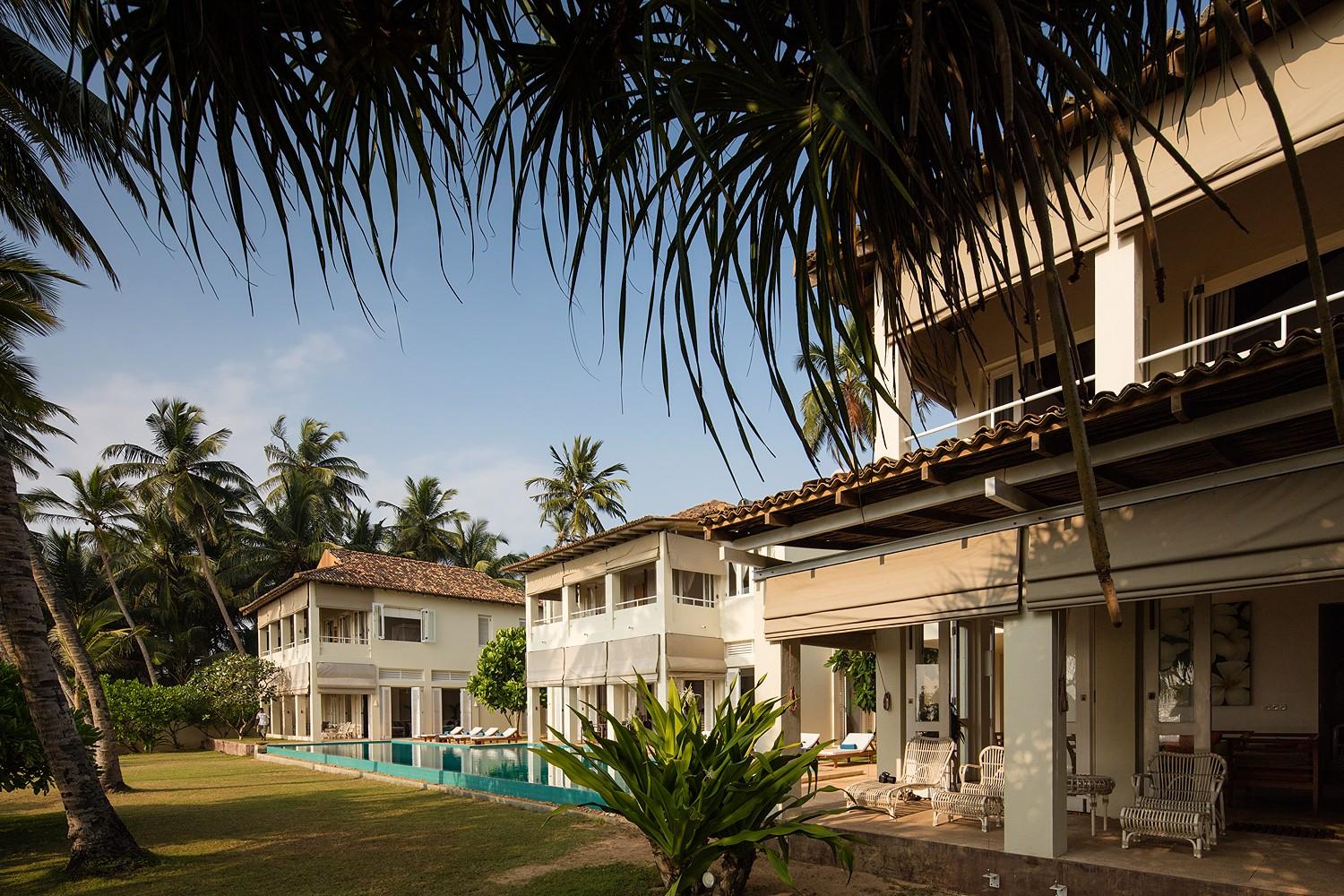 Sri Villas Induruwa exterior with infinity pool, sun terrace and tropical garden