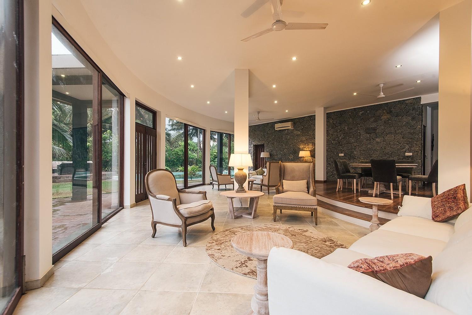 Casa Tua living area with open-plan pool terrace access