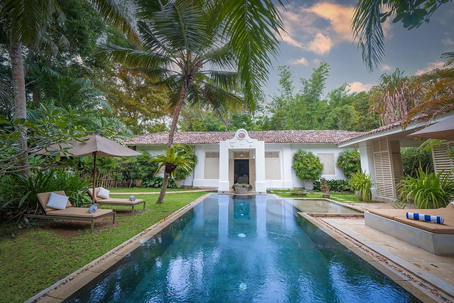 Rivers Edge villa entrance with garden path and tropical planting