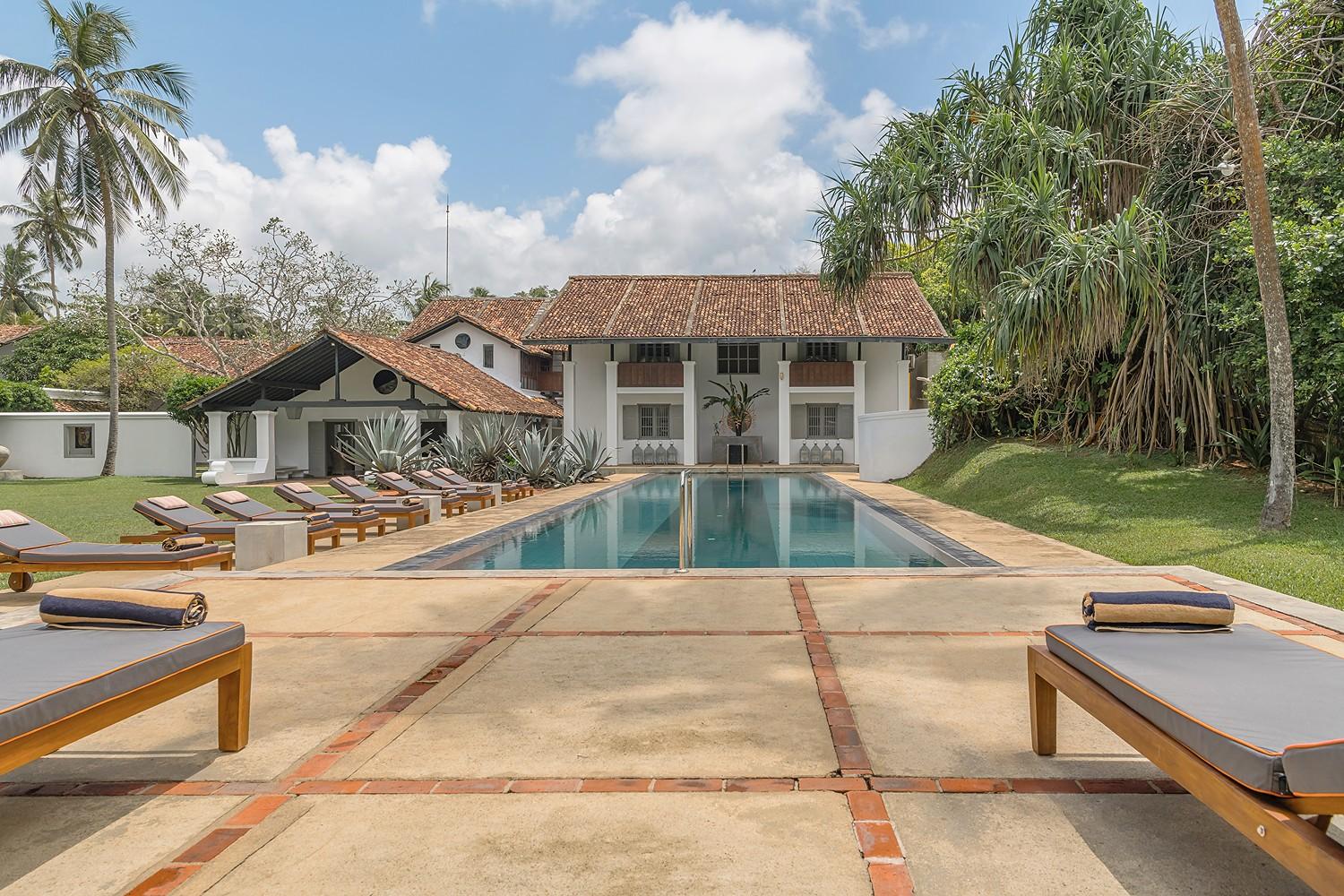 Heritage House Bentota pool with dramatic agave garden bed and Bawa-designed architecture