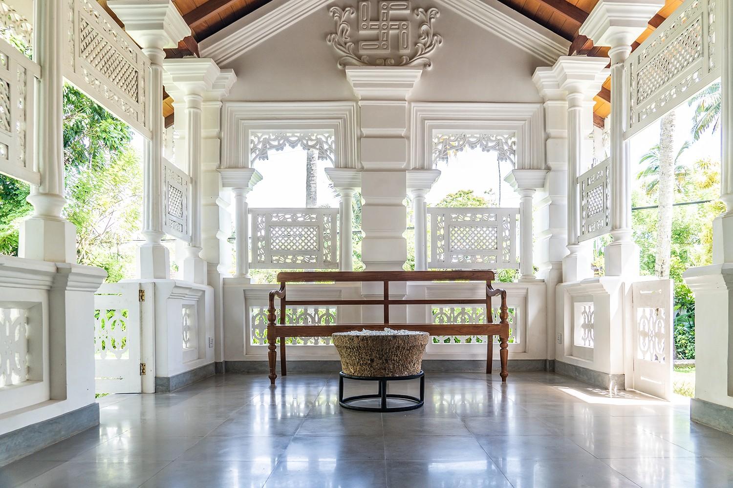 Wide colonnaded entrance hall with polished floors at Island Villa Ahangama, Ahangama
