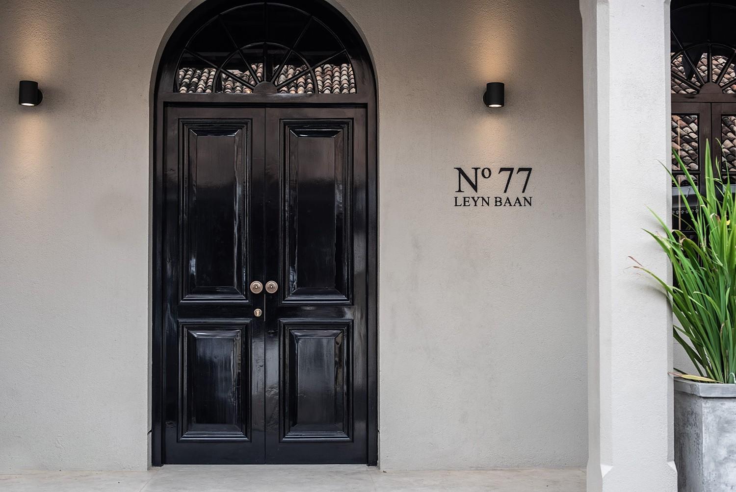 No. 77 Leyn Baan entrance with navy blue double door and number sign, Galle Fort, Sri Lanka