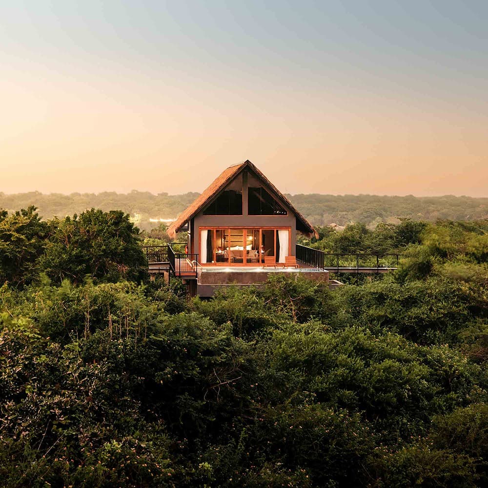 Villa aerial at dusk over forest, Kotiyagala Yala