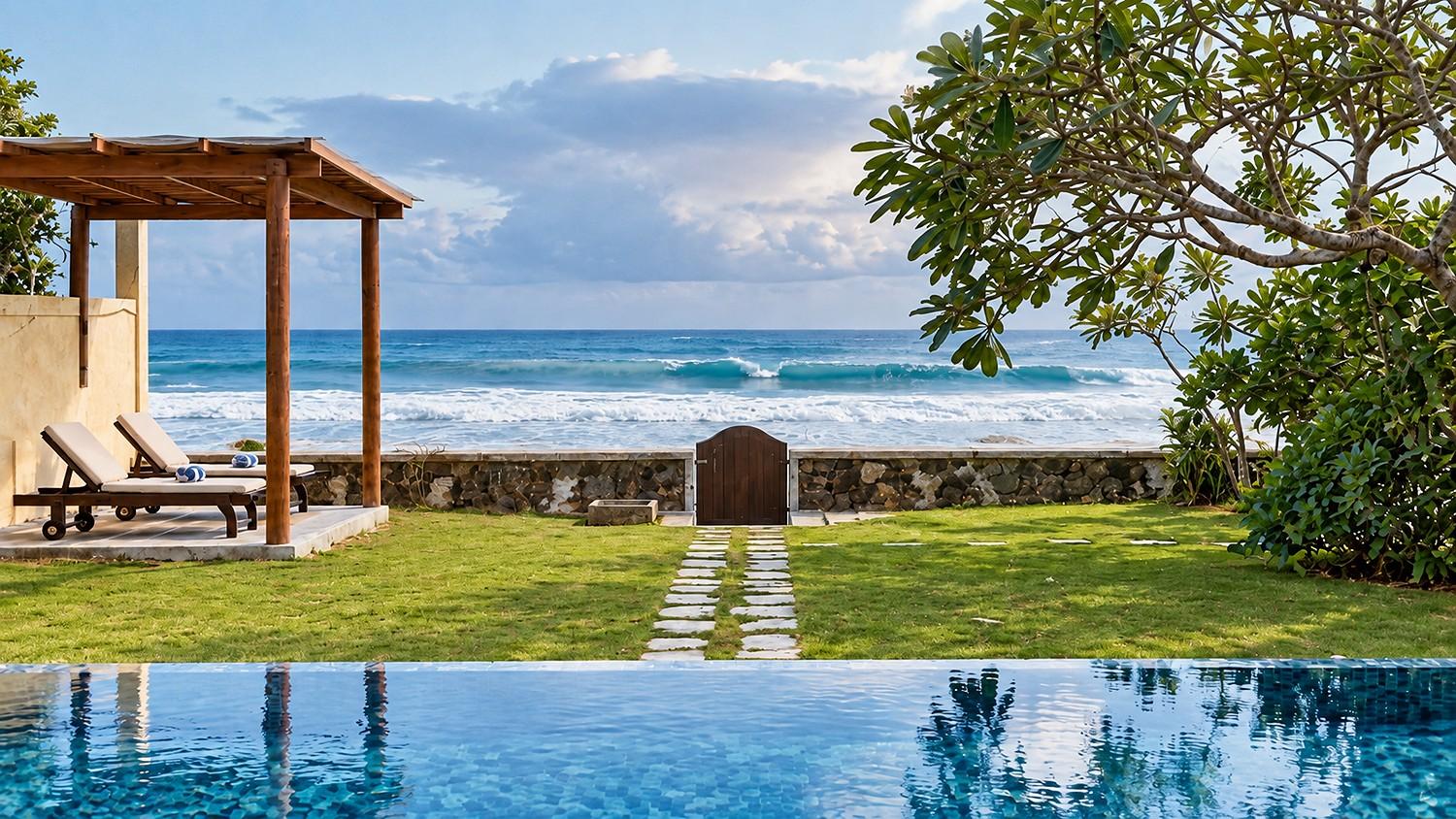 Villa Marisol oceanfront pool with pergola at sunset